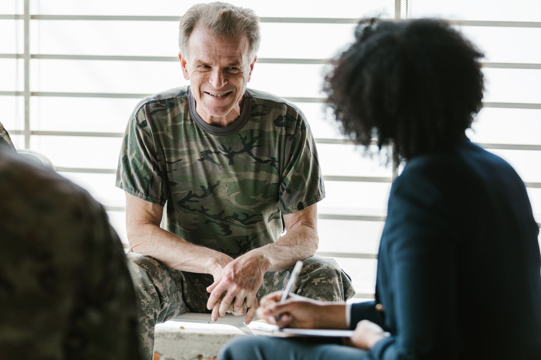 A military veteran engaging in a supportive session, focusing on career and next steps